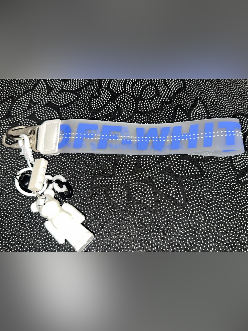 Off-White Clear Strap Keychain with Blue Logo and White Charm